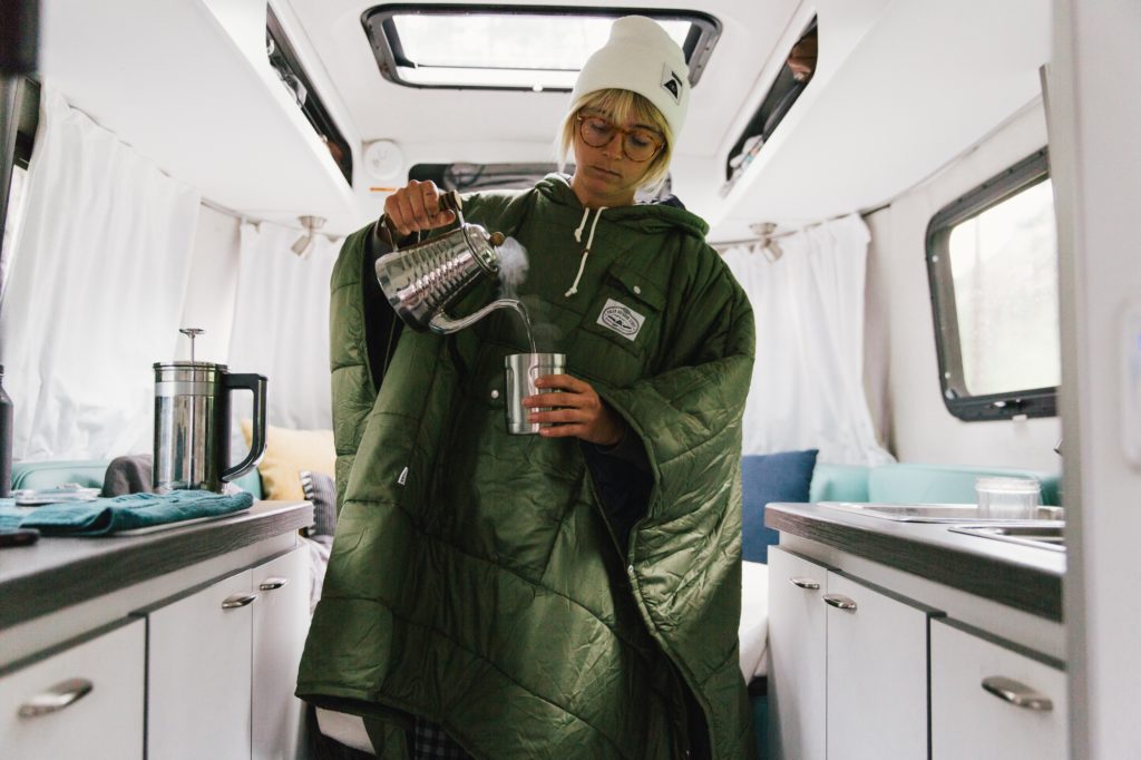 Laura Austin inside Nest Travel Trailer Airstream