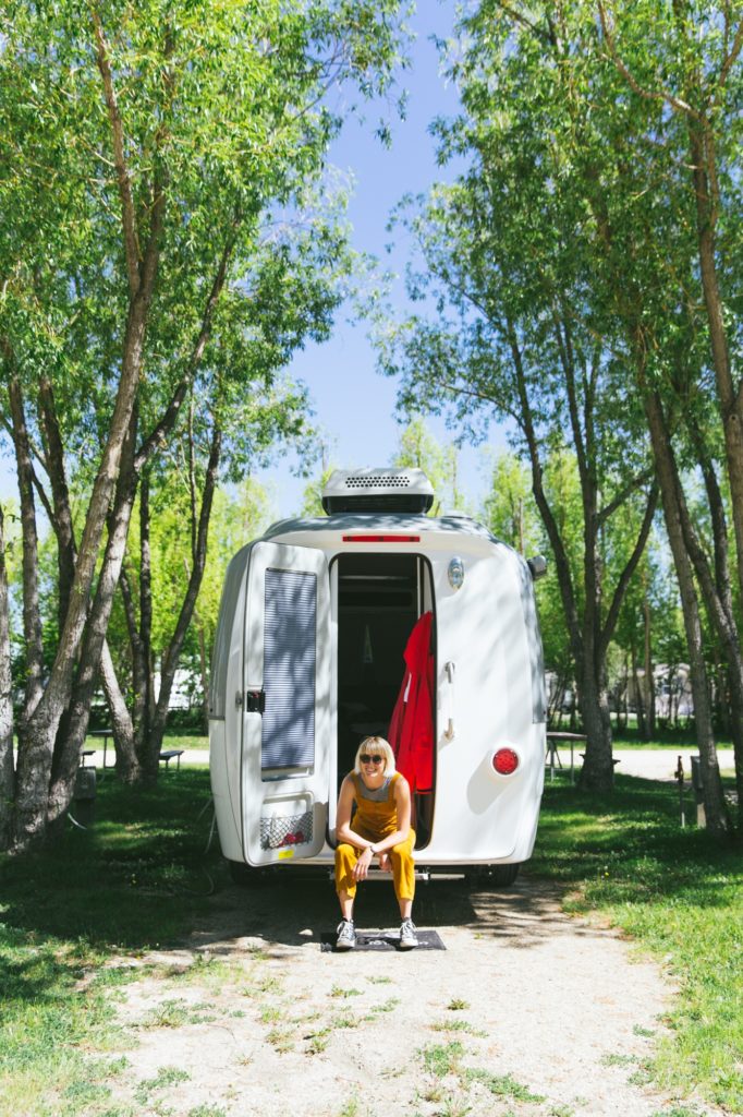 nest by airstream travel trailer rear door and laura austin trees at campsite