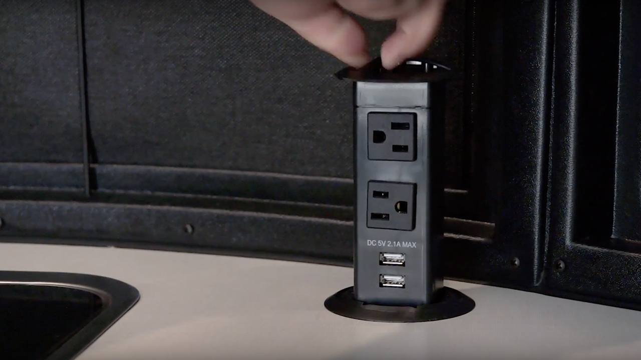 18-AIR_Video_How-To_Travel-Trailer_Basecamp_AC-USB-Popup-Outlets