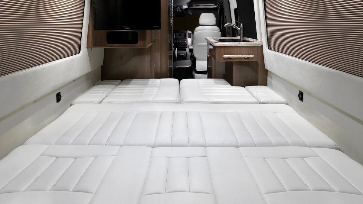 Airstream Interstate Nineteen Mercedes Benz white leather bed down