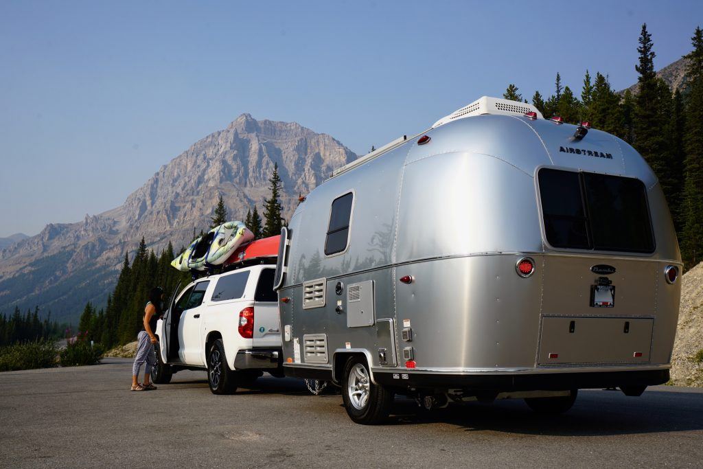 Airstream Bambi Sport Travel Trailer Mountains Trees Road