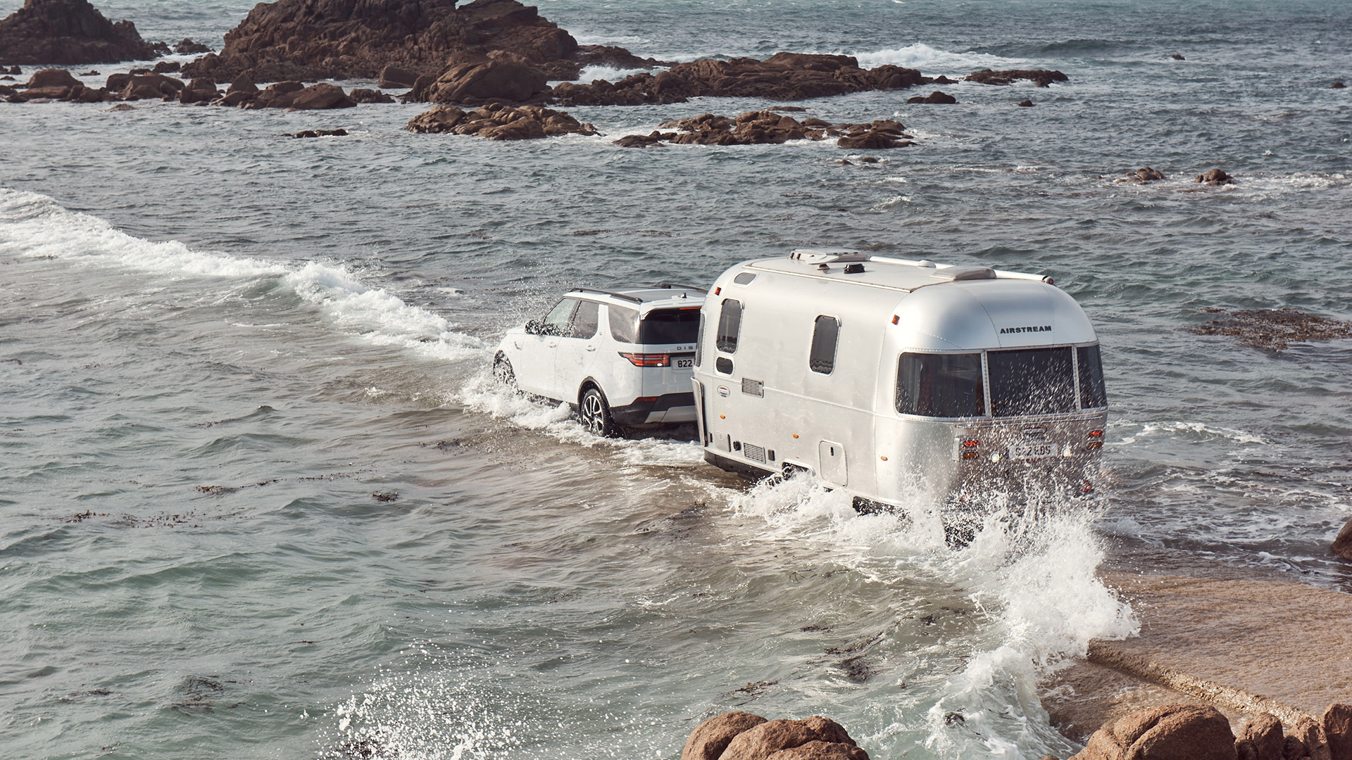 Airstream-Travel-Trailer-with-Land-Rover-Tow-Assist-Technology-in-High-Tide