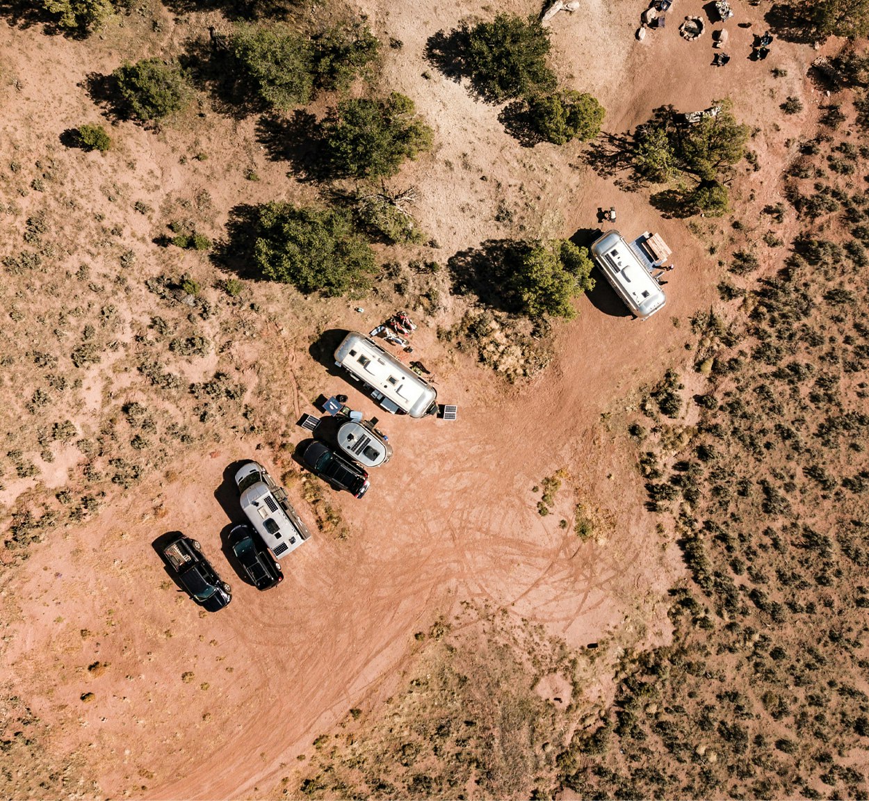 Different Airstream Travel Trailers parked next to each other in Sedona, Arizona with a top view of the area.