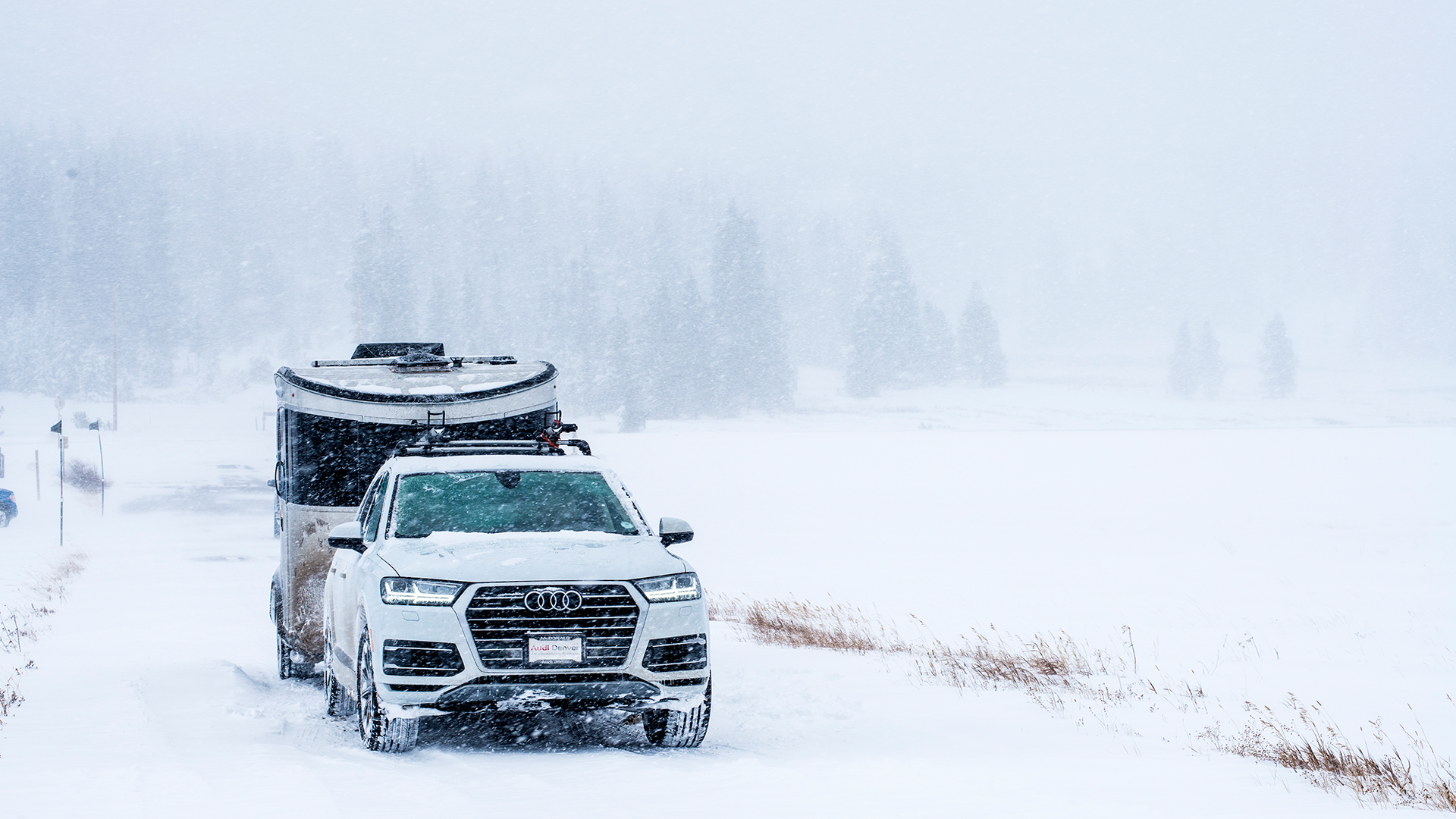 Airstream-Basecamp-Driving-Though-Snow-Audi