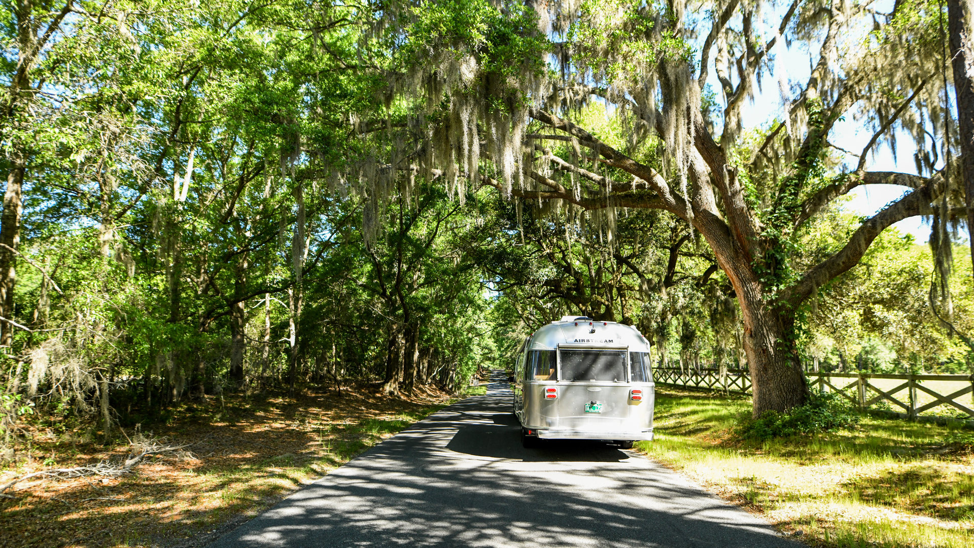 Airstream-Flying-Cloud-on-drive-with-trees