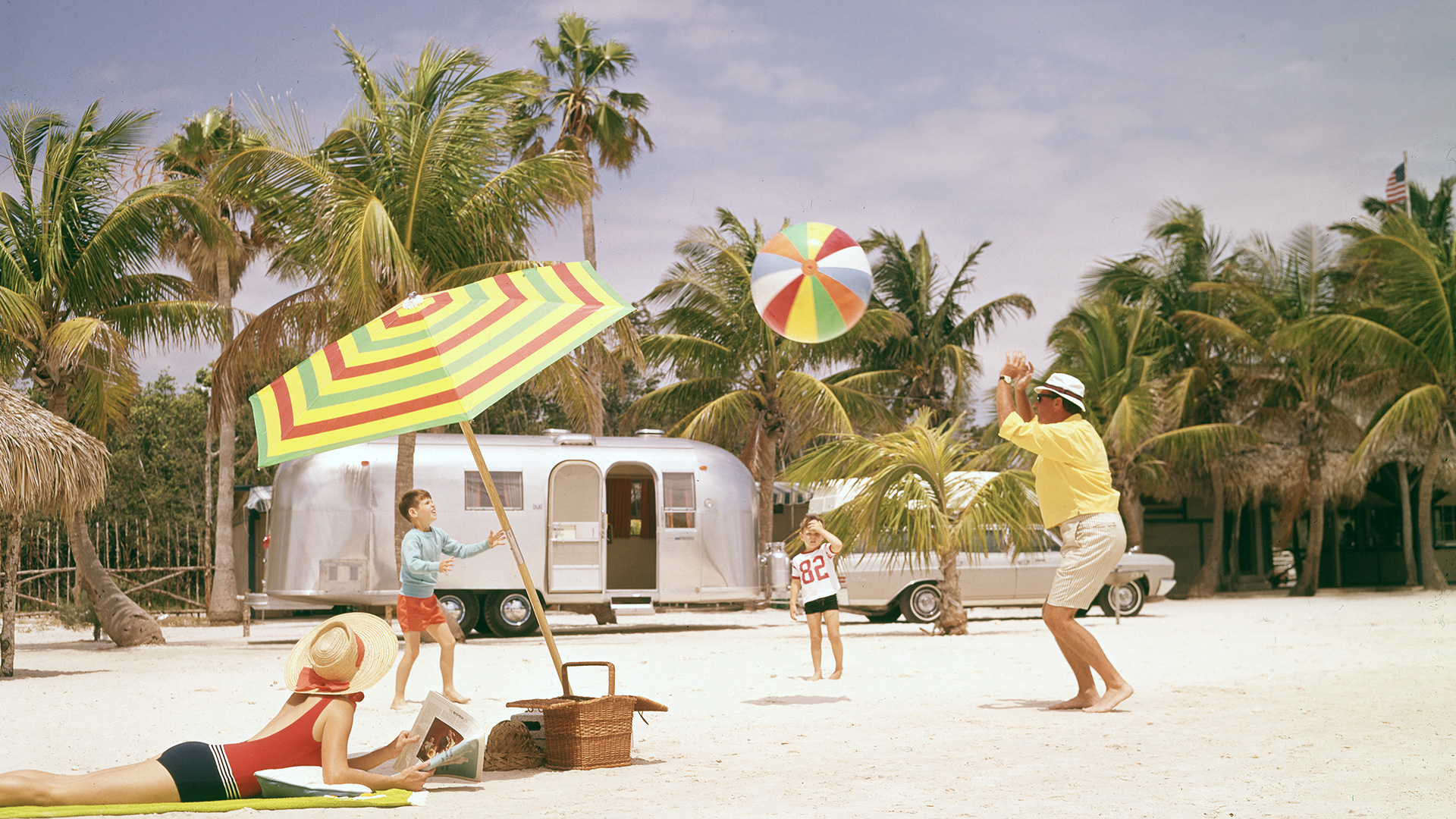 Airstream-Archives-Family-Traveling-and-Playing-Ball-on-Beach