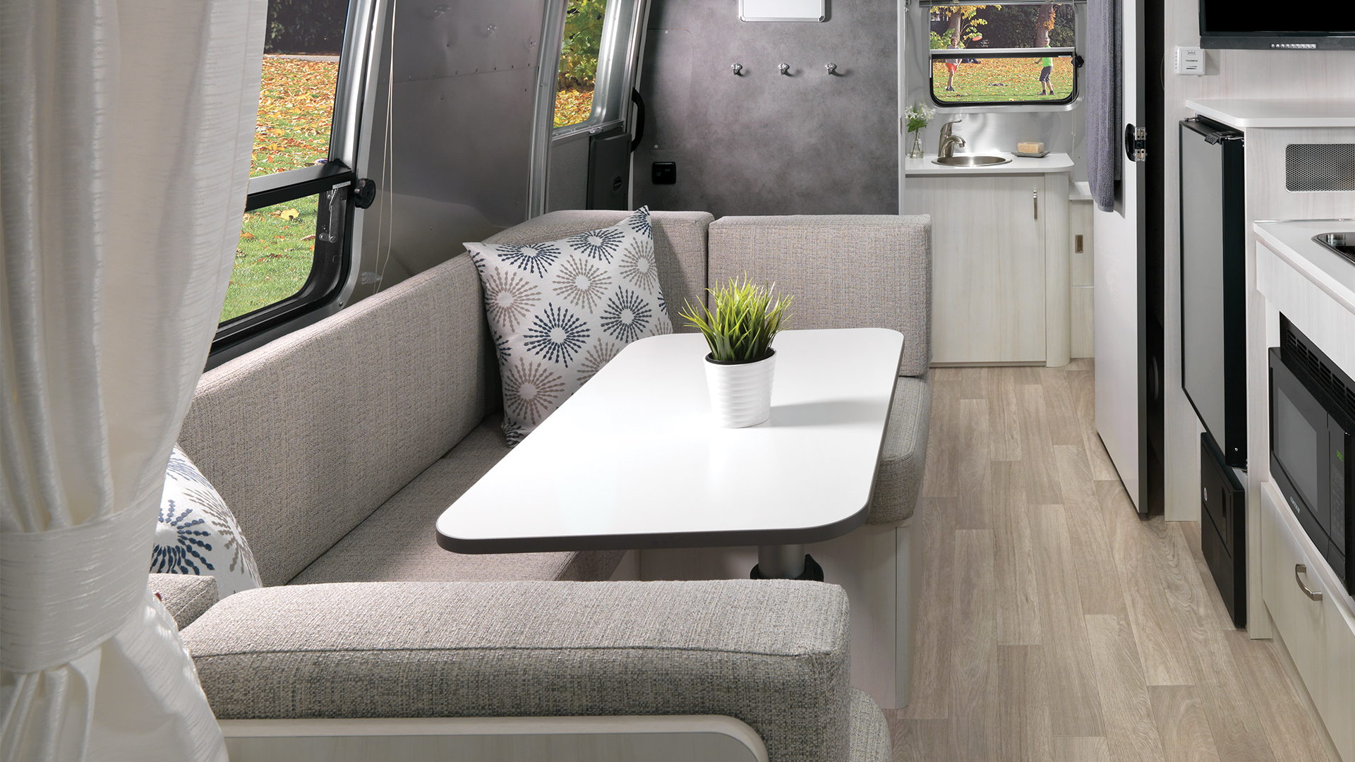 Airstream-Bambi-22FB-Dune-Interior-Dinette-and-Conversion-Bed-Featured-Hotspot