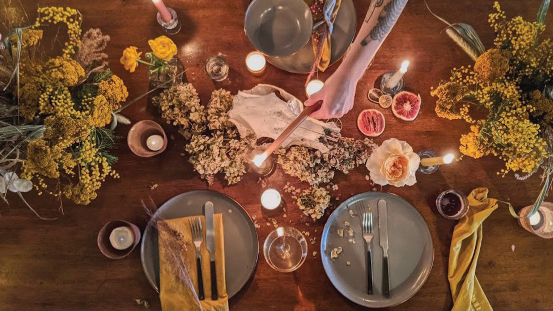 Food and candles sitting on a table