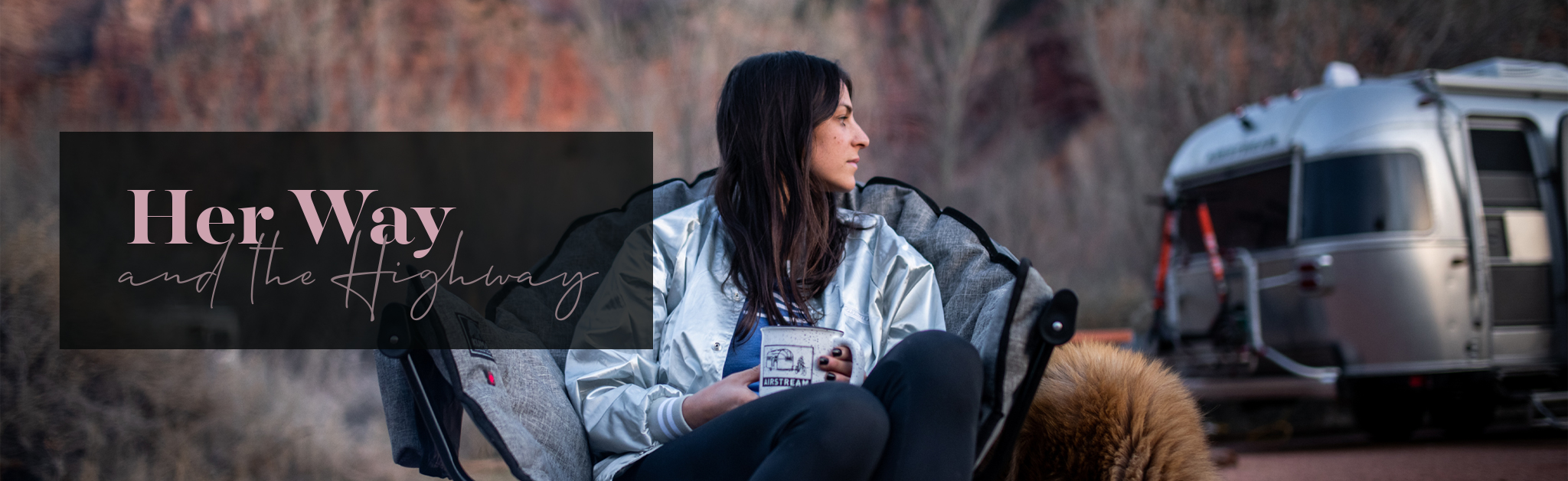 Danielle drinking coffee outside of her Airstream trailer