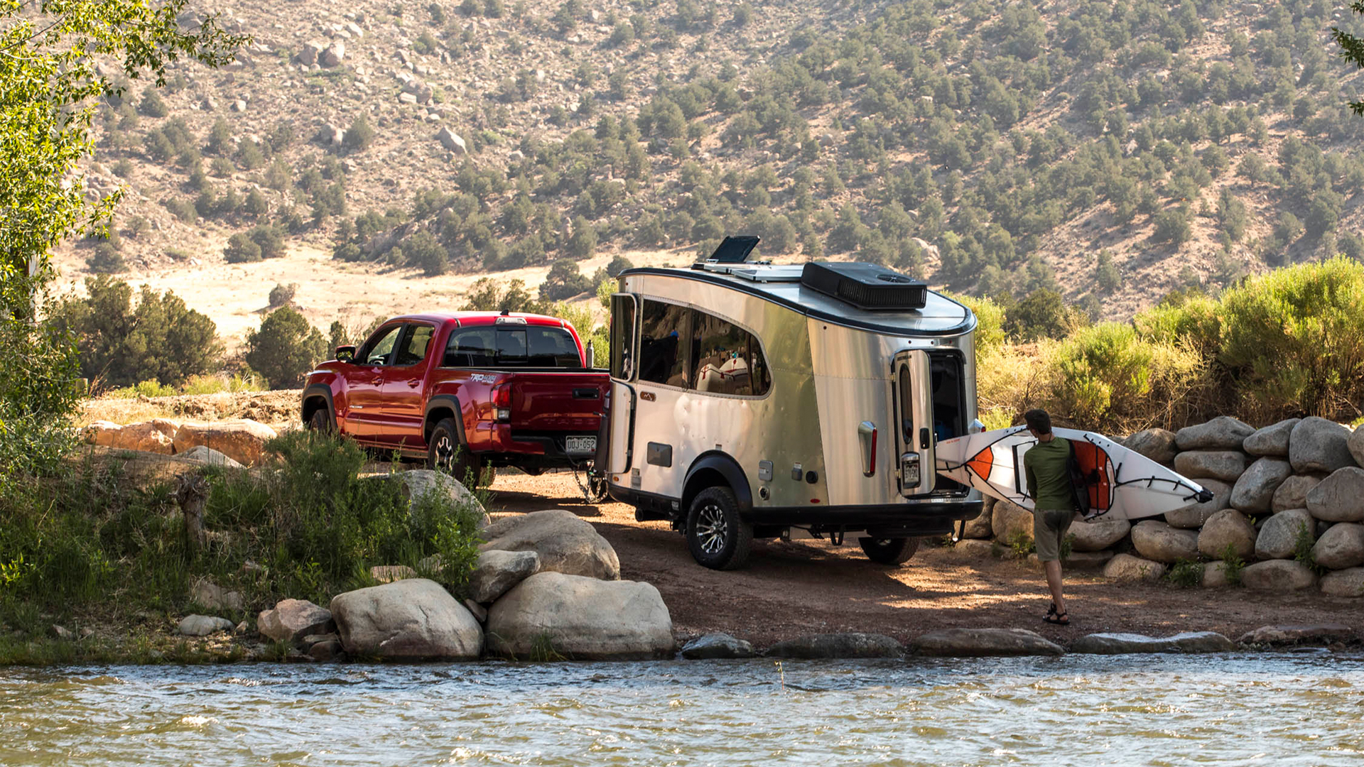 Loading-a-kayak-in-a-basecamp-Airstream-trailer