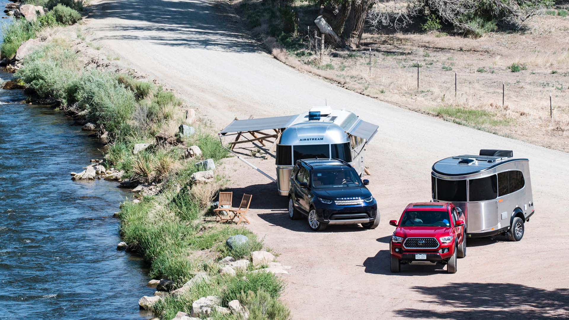 An SUV and a truck pulling Airstream trailers