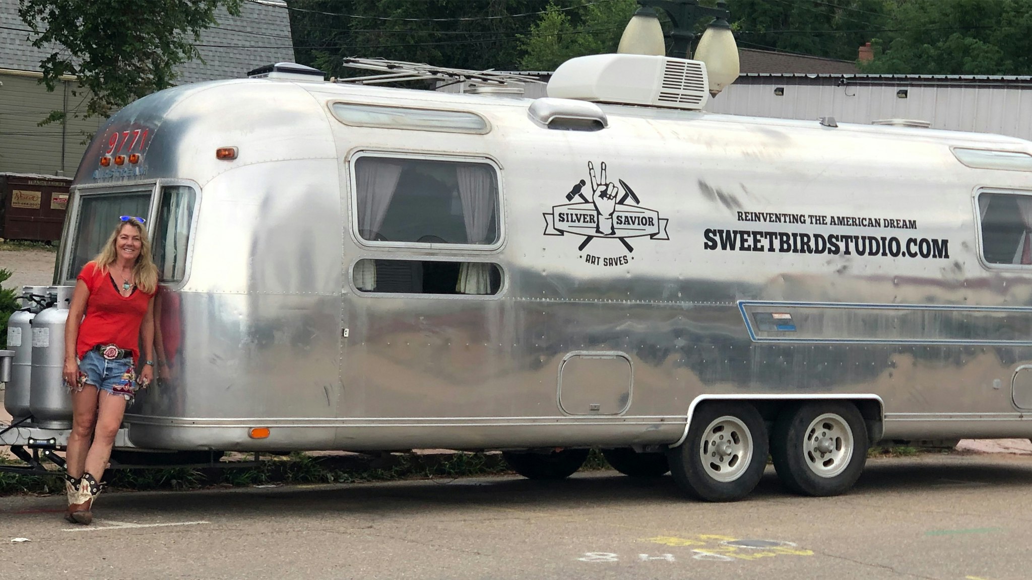 Sweet Bird Studio owner in from of her Airstream