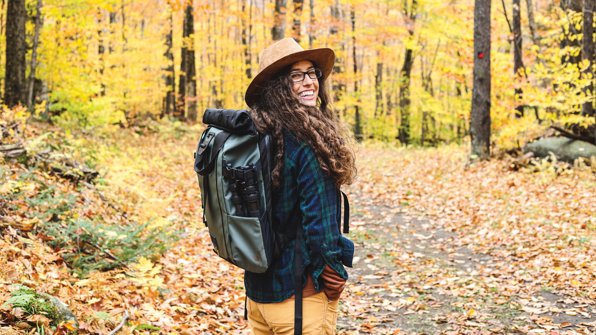 Airstream Ambassador Marisa hiking through the woods