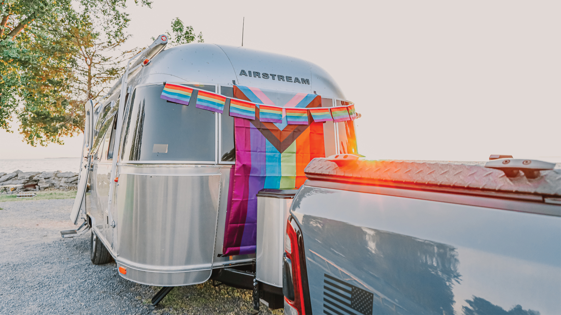 Pride flags hanging on an Airstream Travel Trailer