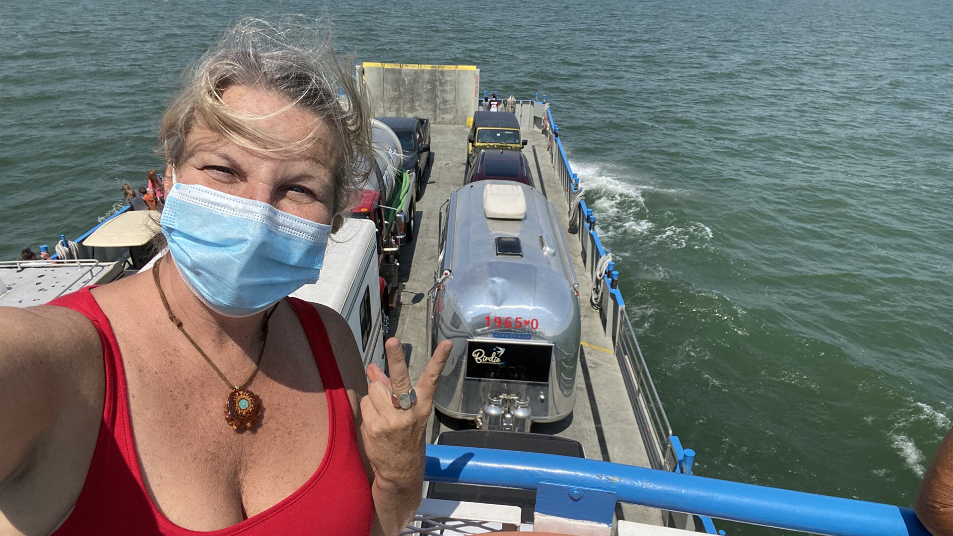 Lindy B on a boat with her Airstream while she travels around the world