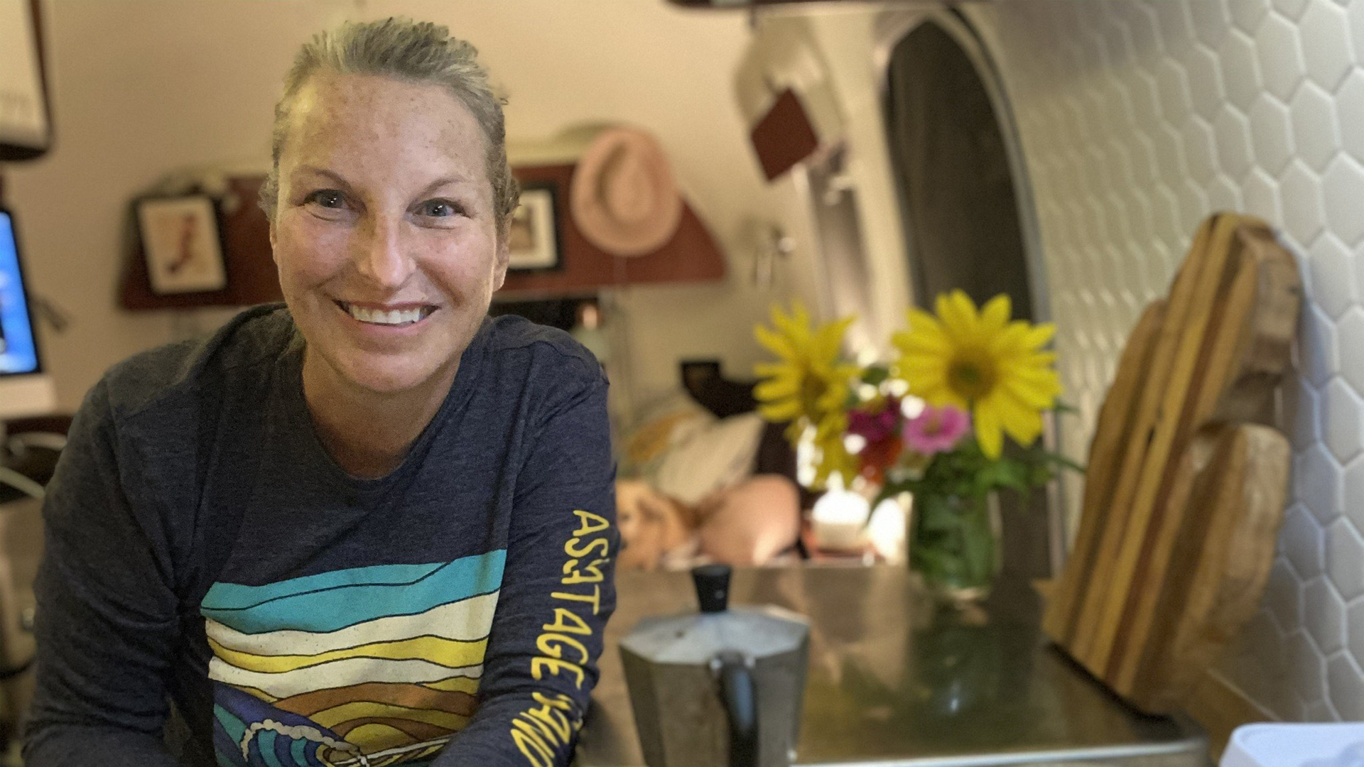 Lindy B sitting in her Airstream