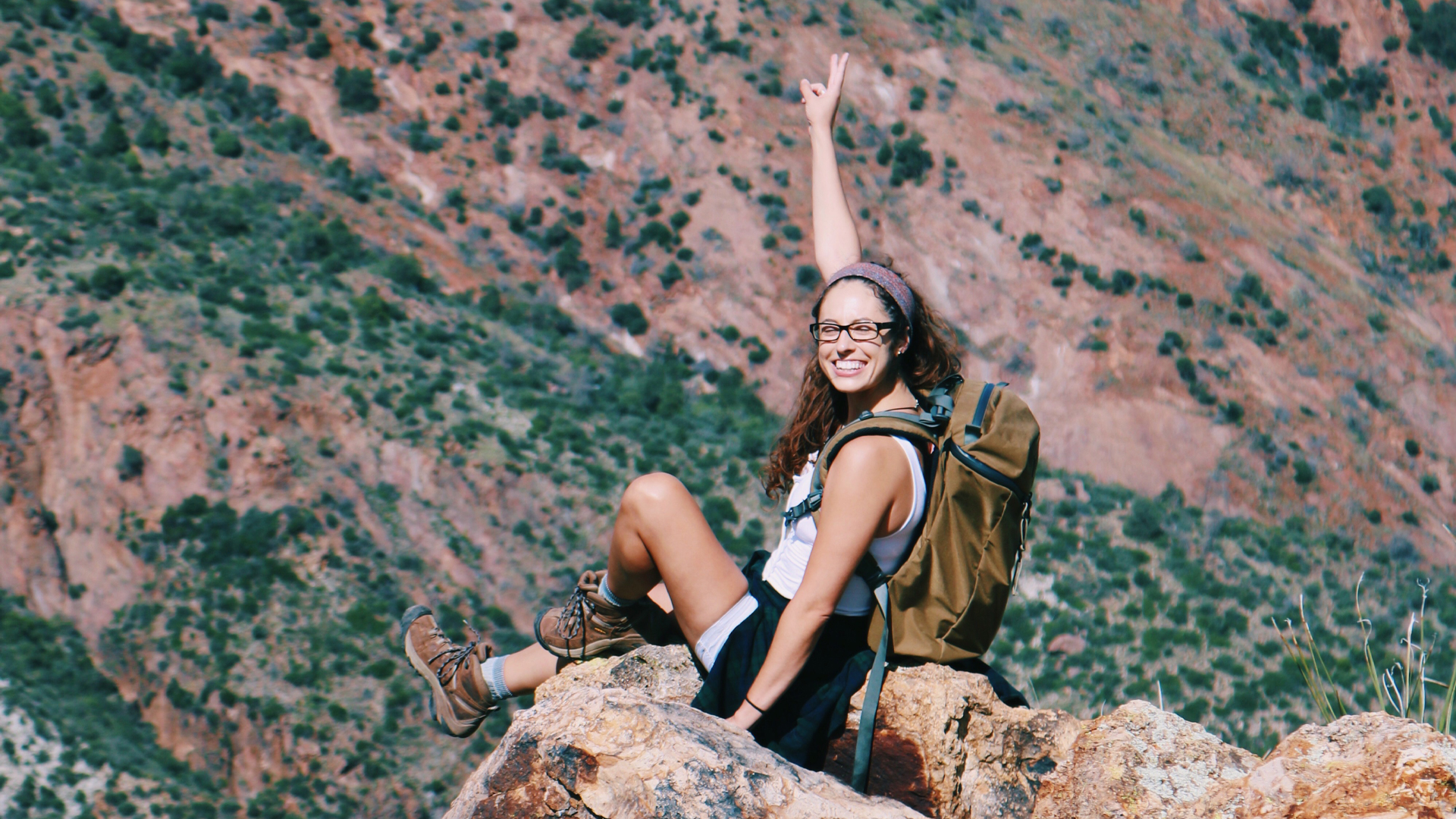 Marisa sitting in the mountains