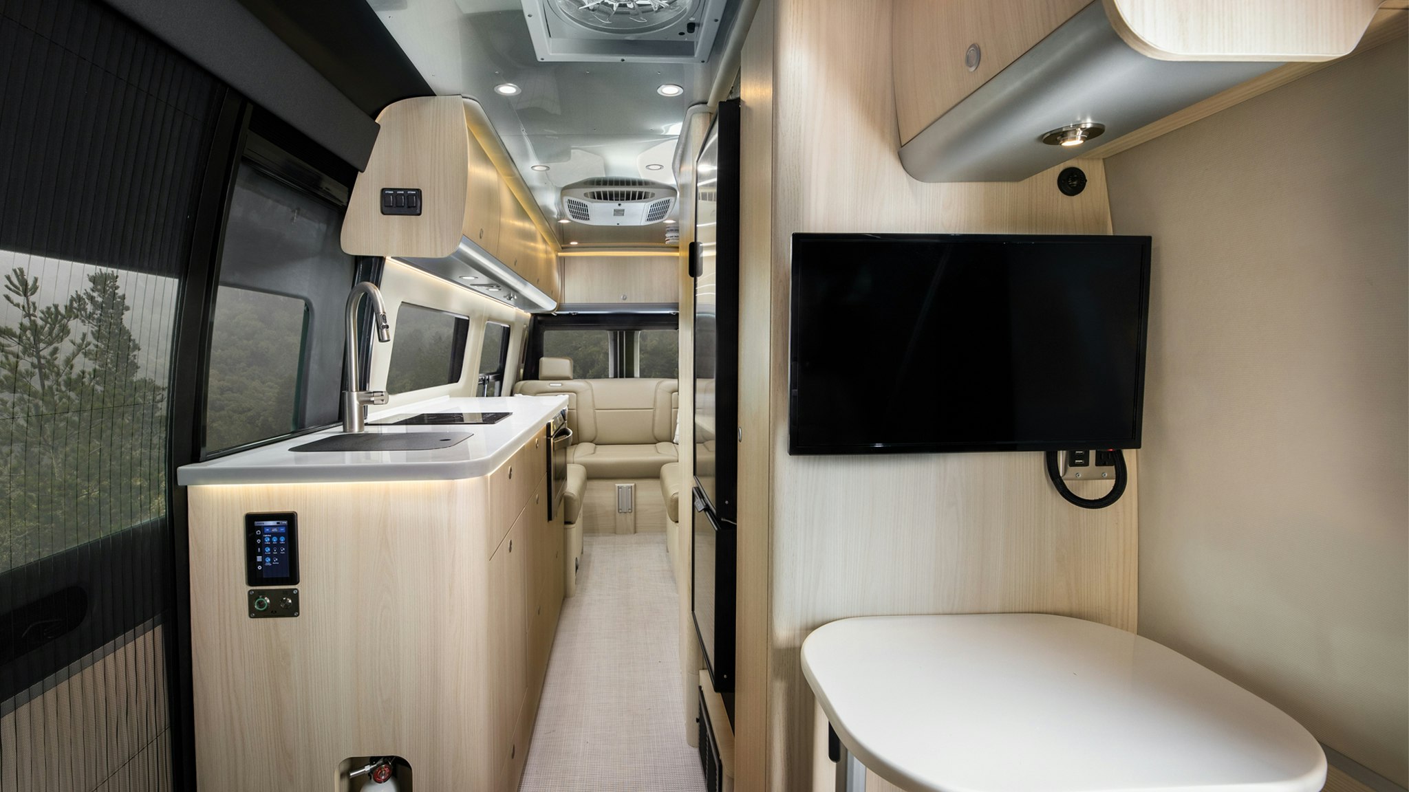 The Airstream Interstate 24GL Touring Coach with Classic Canyon interior from the front to the back of the class b motorhome