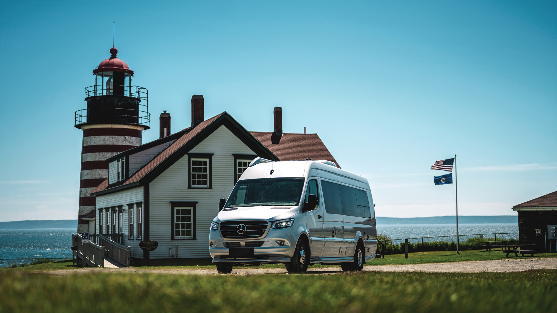 Airstream Class B RV Interstate 24 sitting in front of a lighthouse
