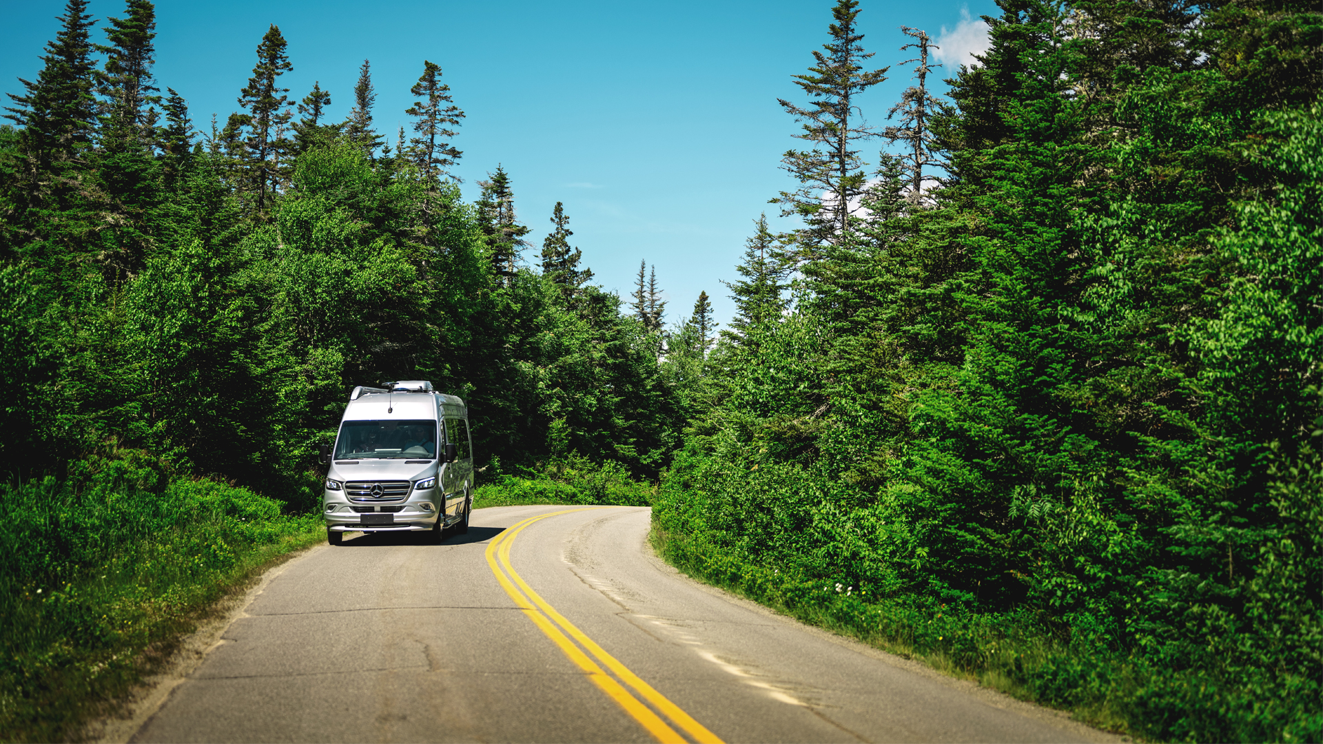 Airstream Touring Coach driving down the road