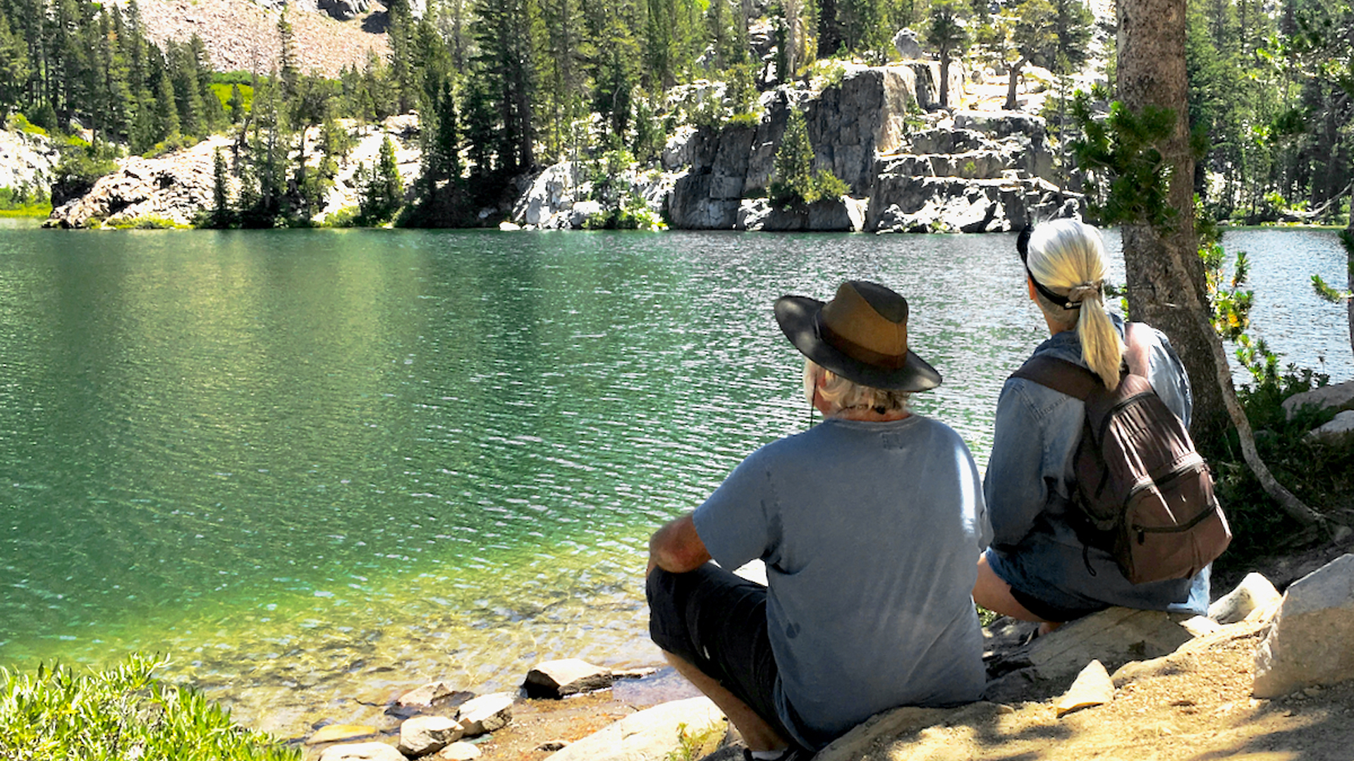 Jim and Carmen sitting at a River