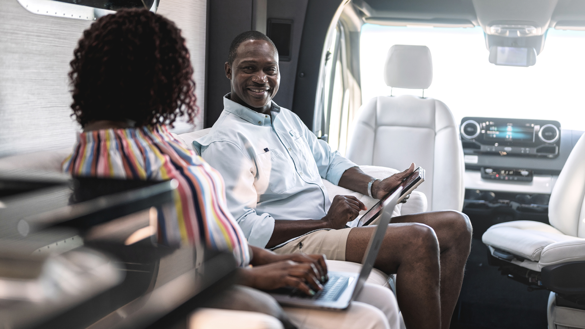 Two people working from their Airstream Touring Coach