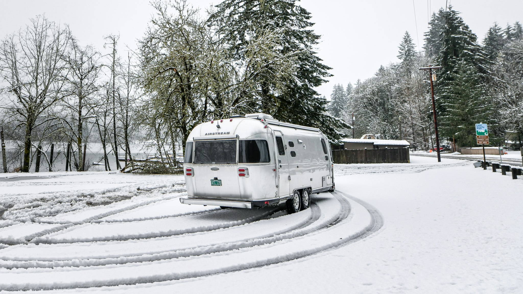 Airstream Travel Trailer driving through snow