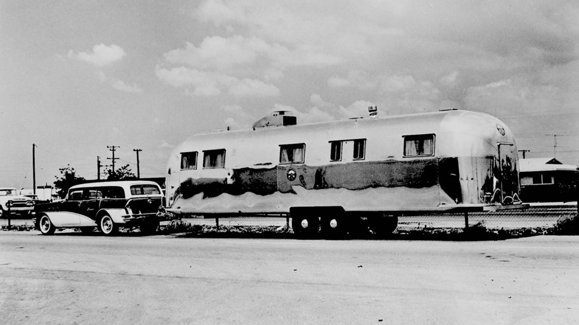 A 1958 Airstream Commercial travel trailer that was created for the Railroad that is being towed.