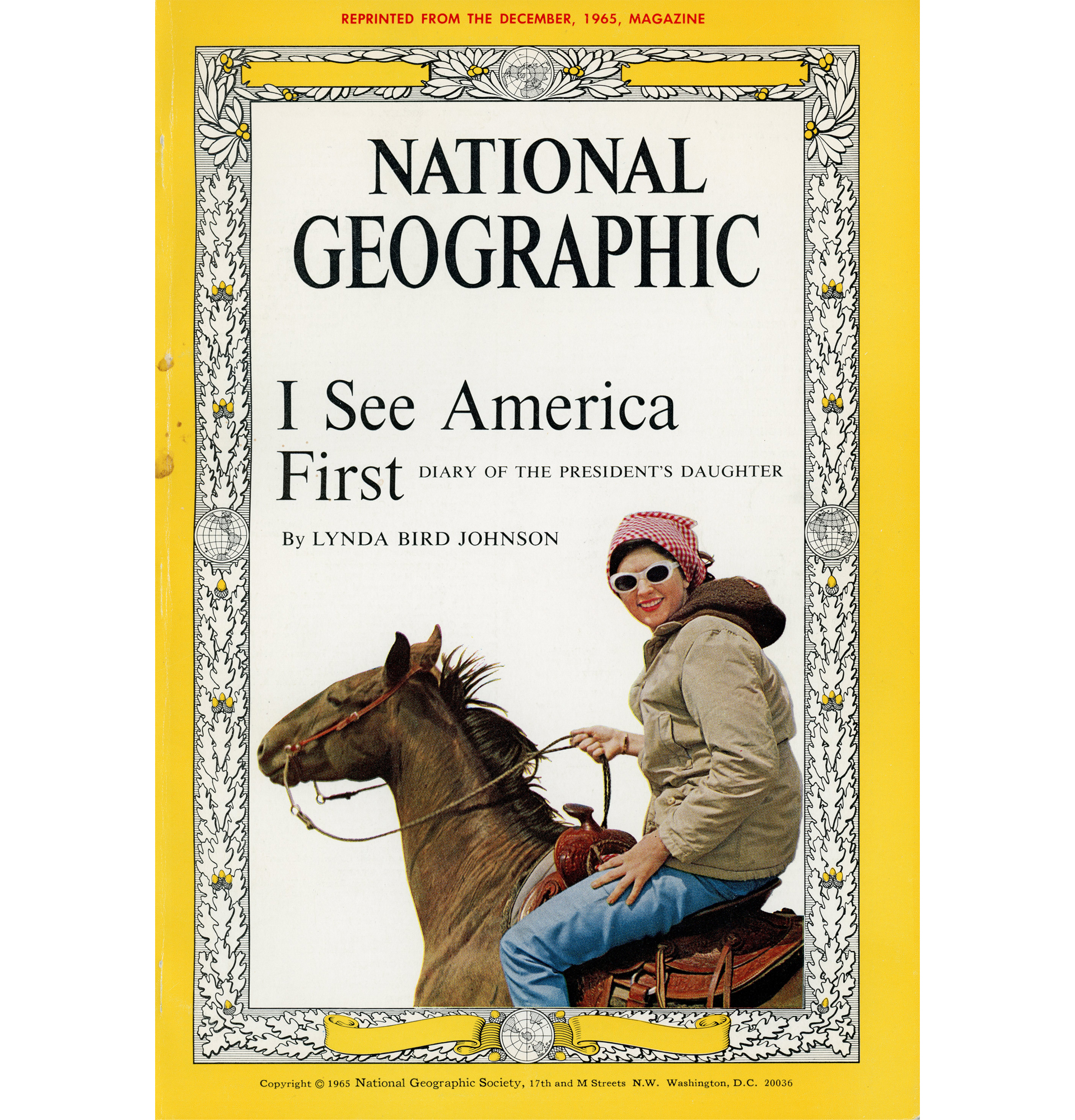 An old cover of National Geography with a lady riding a horse with the title "I See America First"