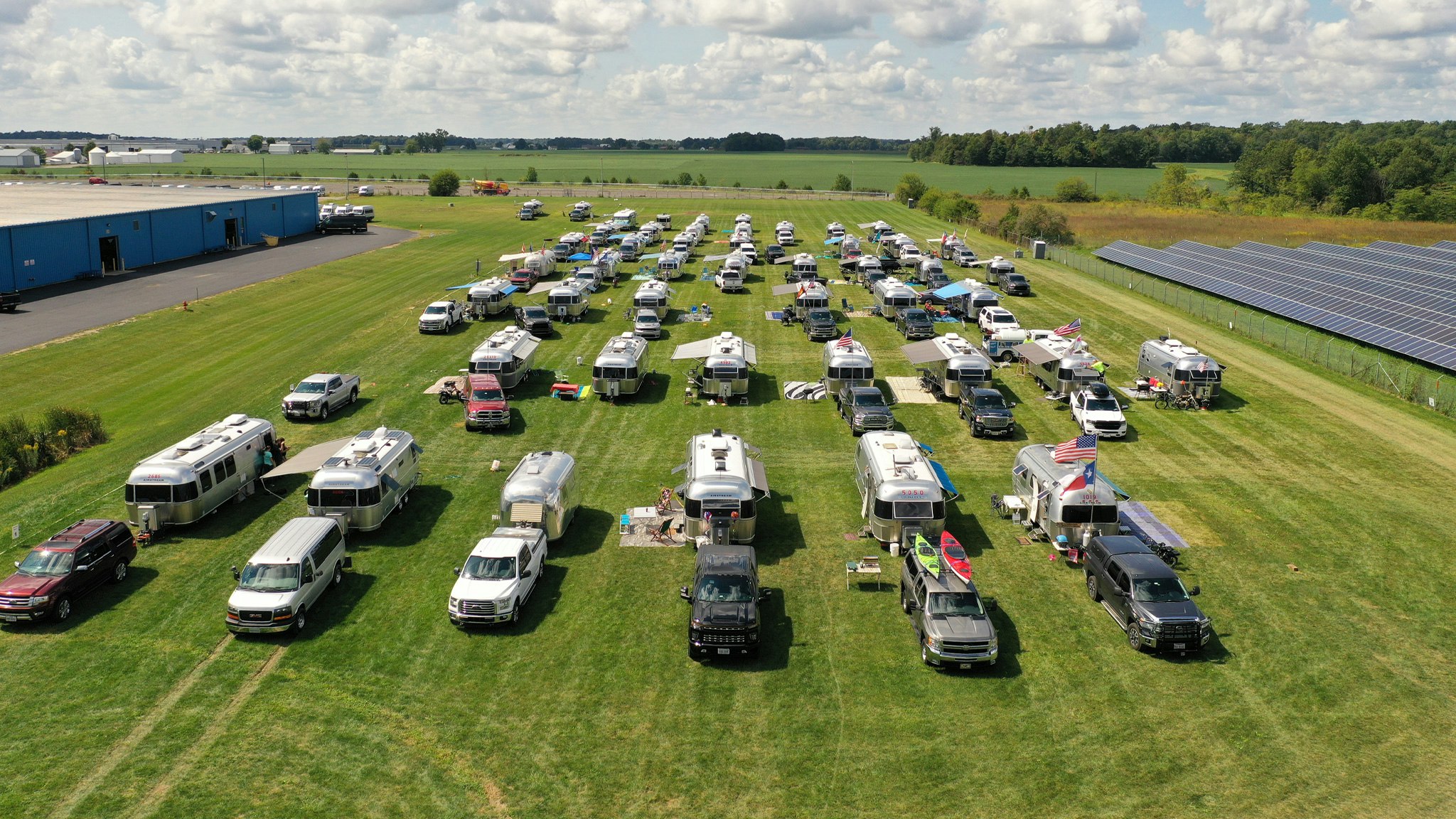 Many Airstream Travel Trailers and Touring Coaches parked at Airstream Headquarters during Alumapalooza in Jackson Center, Ohio.
