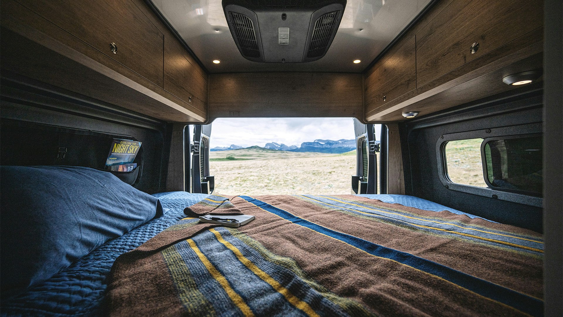 Airstream-Rangeline-Bed-Down-Lifestyle-Rear-Door