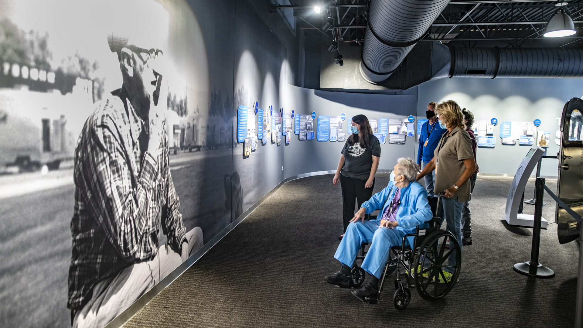 The Smith Family touring the Airstream Heritage Center with Airstream Historian, Samantha Martin, during the Grand Opening