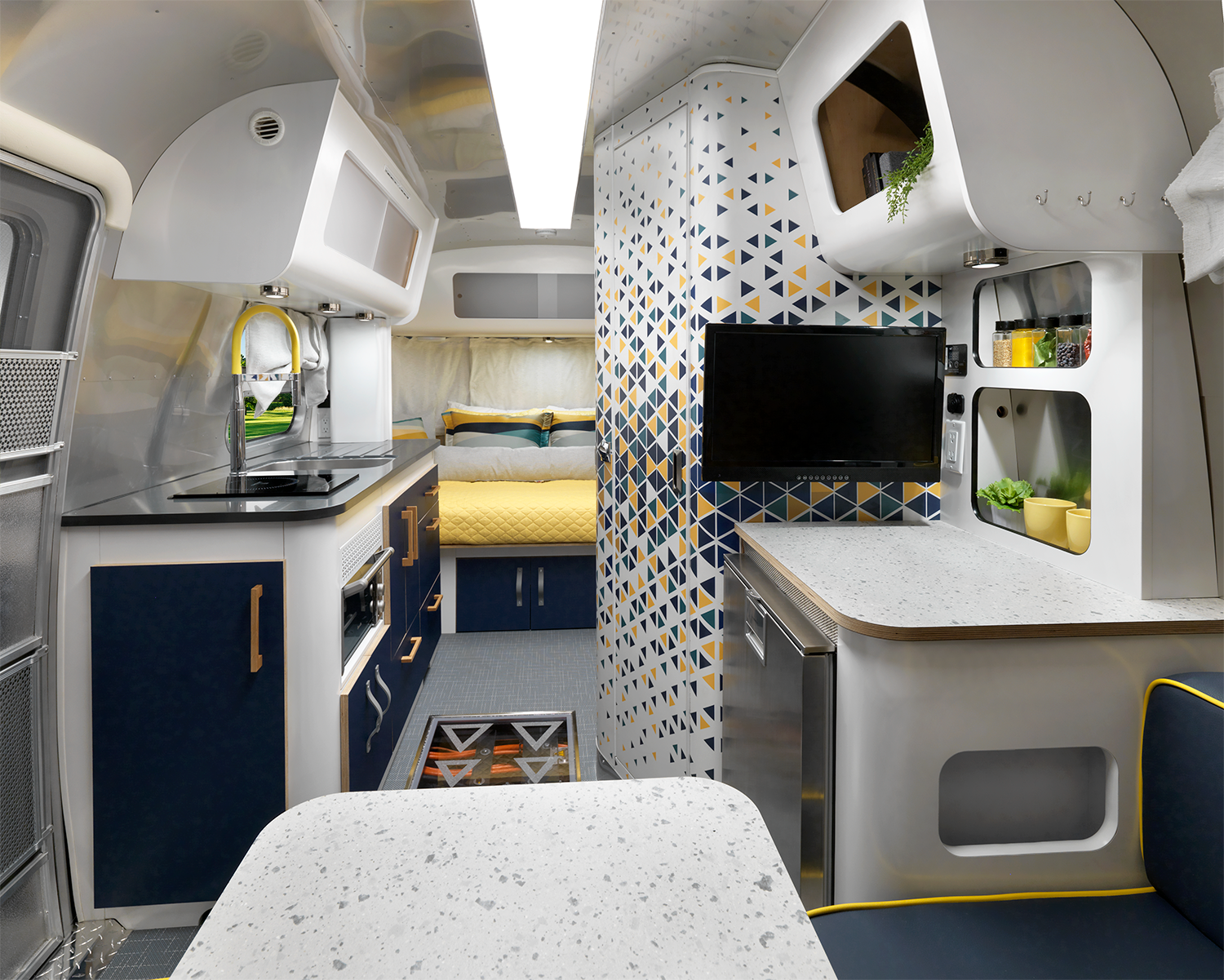 The galley and bedroom in Airstream's all electric estream travel trailer concept travel trailer.