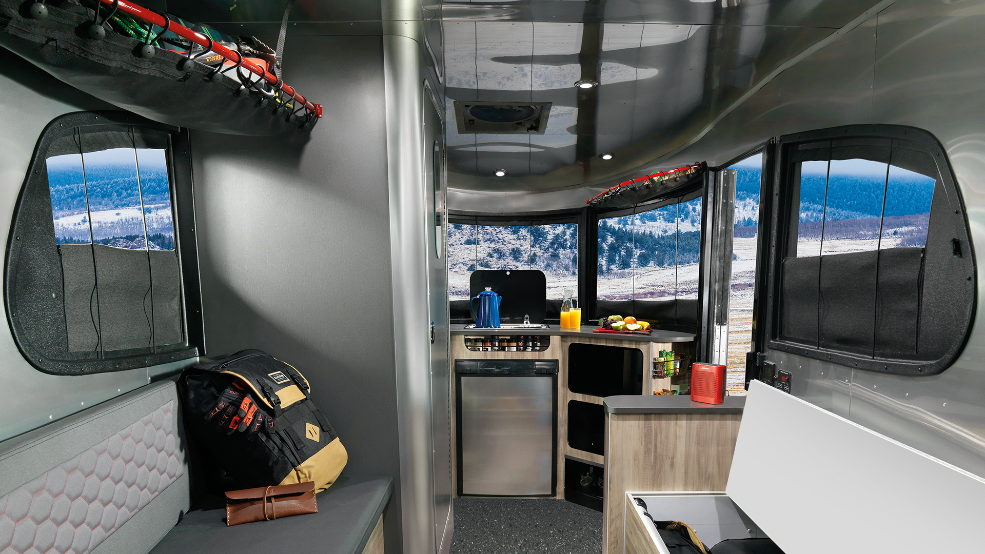 A panoramic view out of the windows of an Airstream Basecamp travel trailer.