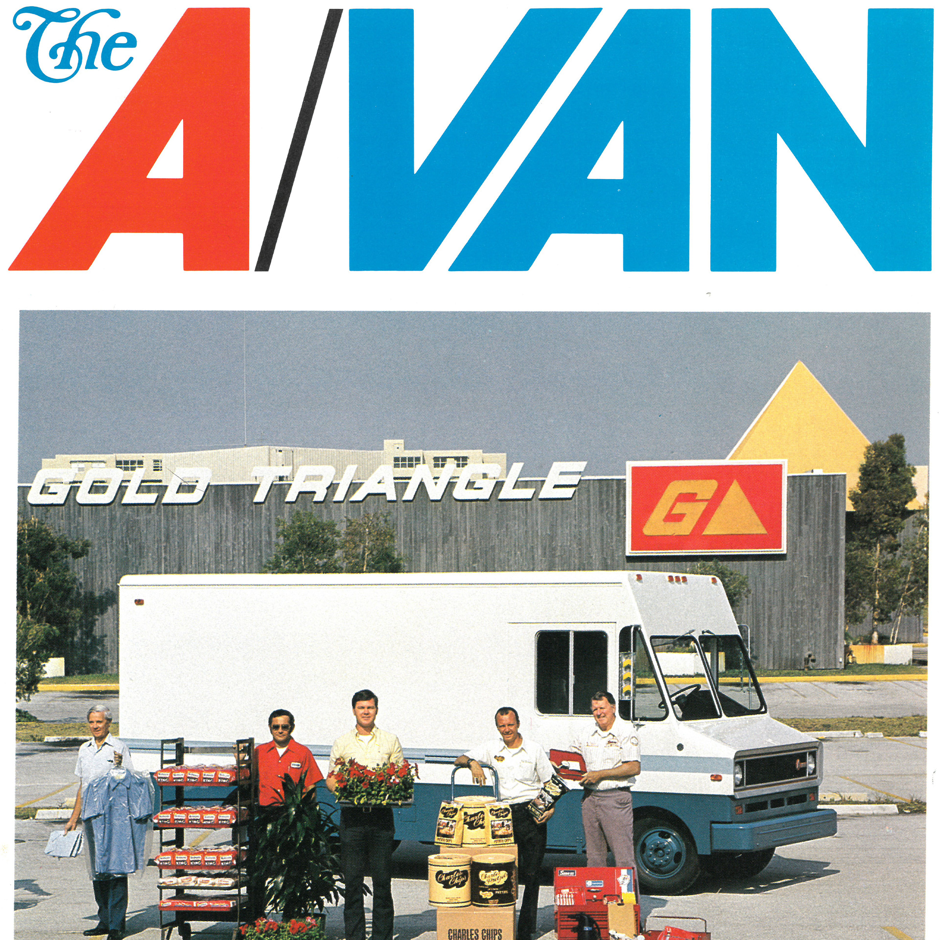 A group of Airstream workers standing next to the vintage Airstream A/Van