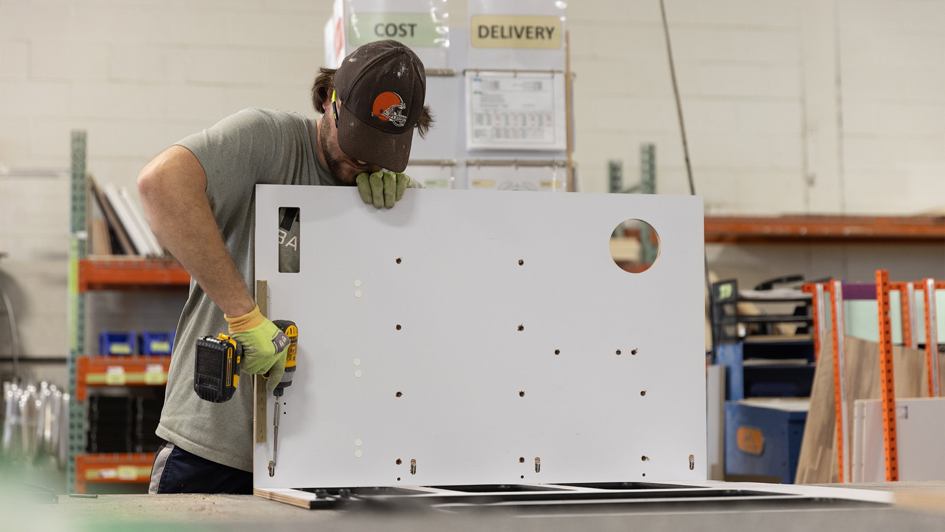 An Airstream employee building the cabinetry for the Airstream Basecamp travel trailer