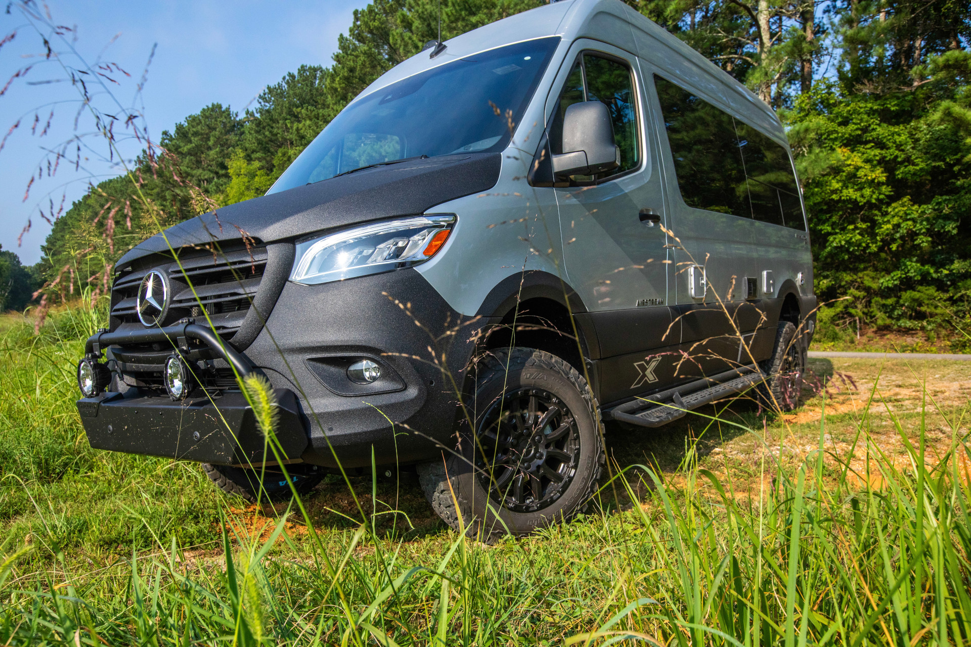 Airstream Interstate 19X Class B Motorhome driving off the road