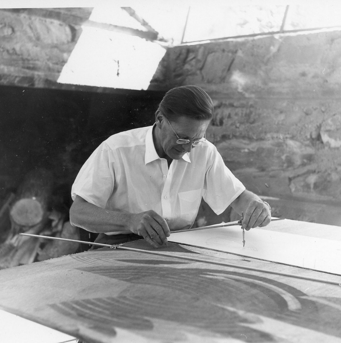 Eugene "Gene" Masselink working on a mural in Frank Lloyd Wright's Taliesin West's office, April 1960From the John Amarantides papers, Frank Lloyd Wright Foundation Collection Eugene "Gene" Masselink working on a mural in Frank Lloyd Wright's Taliesin West's office, April 1960 Eugene "Gene" Masselink working on a mural in Frank Lloyd Wright's Taliesin West's office, April 1960. 1910.629.1-6. The mural from the TAA designed Lewis and Roca law firm in Phoenix. From the John Amarantides papers, Frank Lloyd Wright Foundation Collection